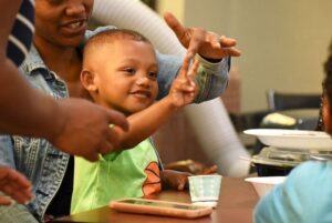 Kid playing with caregiver