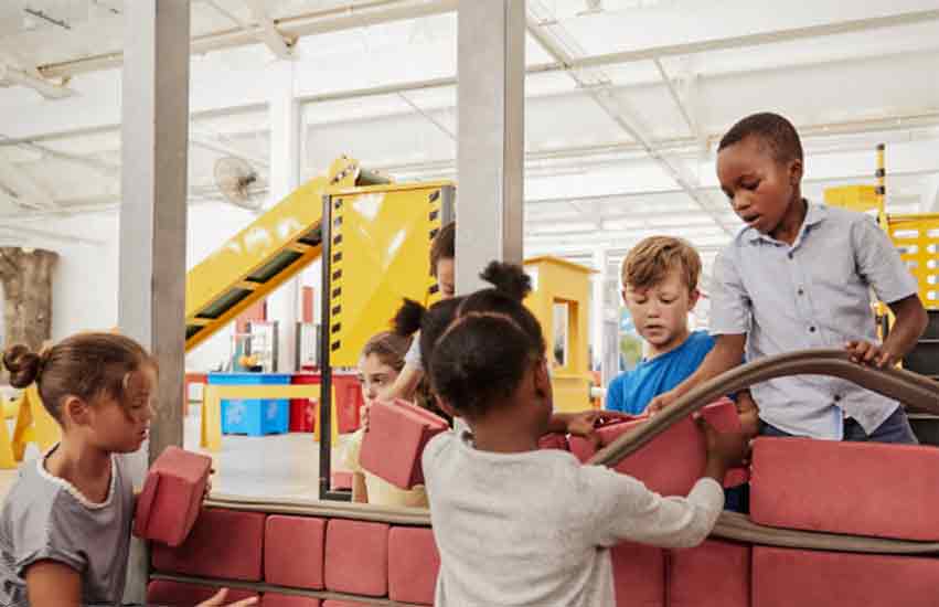 Kids with a car exhibit