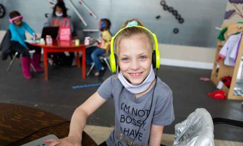 Young girl using a learning pod